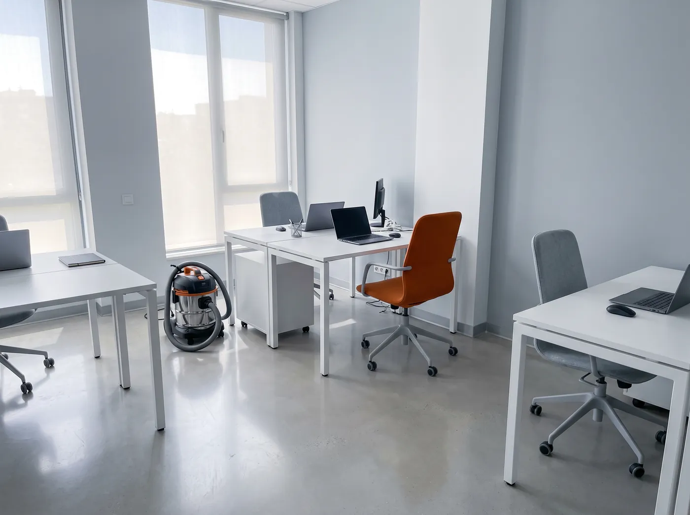 A freshly cleaned office with tidy desks and a polished floor
